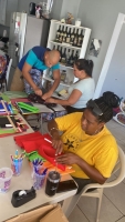 Aruba One Happy Island Lions Club a haci entrega di schooltas 