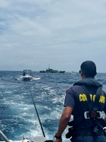 Wardacosta a rescata dos piscado den laman cerca di Rodgers Beach