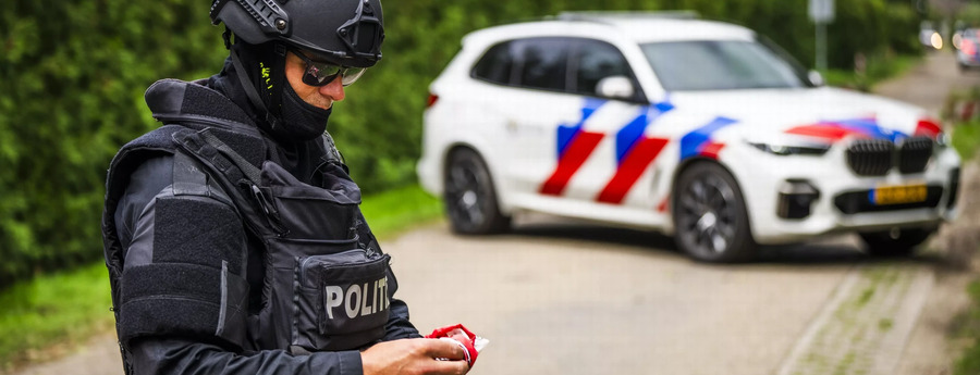 32 suspects charged as group in murder of security guard in Netherlands